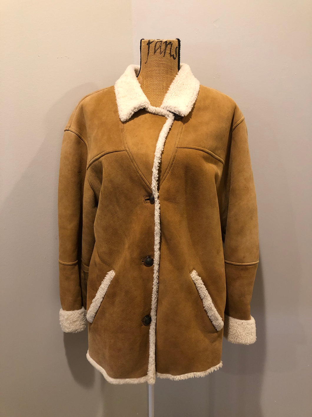 Kingspier Vintage - Timberland tan suede lambskin coat with shearling trim and lining, button closures and slash pockets. Coat is water resistant. Size medium.