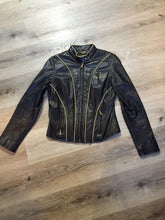 Load image into Gallery viewer, Kingspier Vintage - Baby Phat black leather moto jacket with gold piping and “Baby Phat” embroidered on the chest, front zipper and two vertical zip pockets. A pattern is stitched into the elbows and “Baby Phat” is stitched across the back. Size small.
