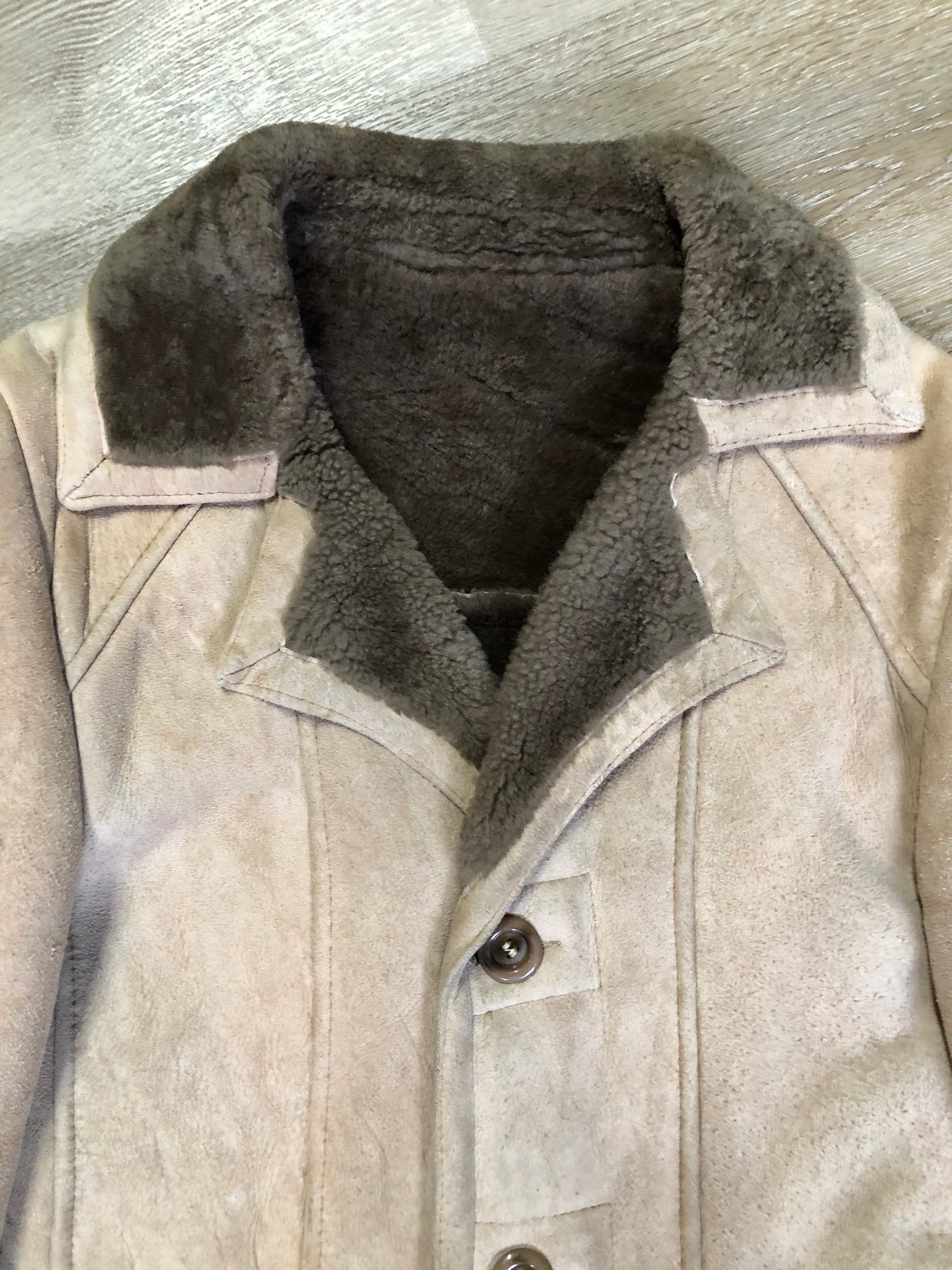 Kingspier Vintage - Leather Attic light brown suede coat with shearling lining, button closures and vertical pockets. Made in Canada. Size 38.