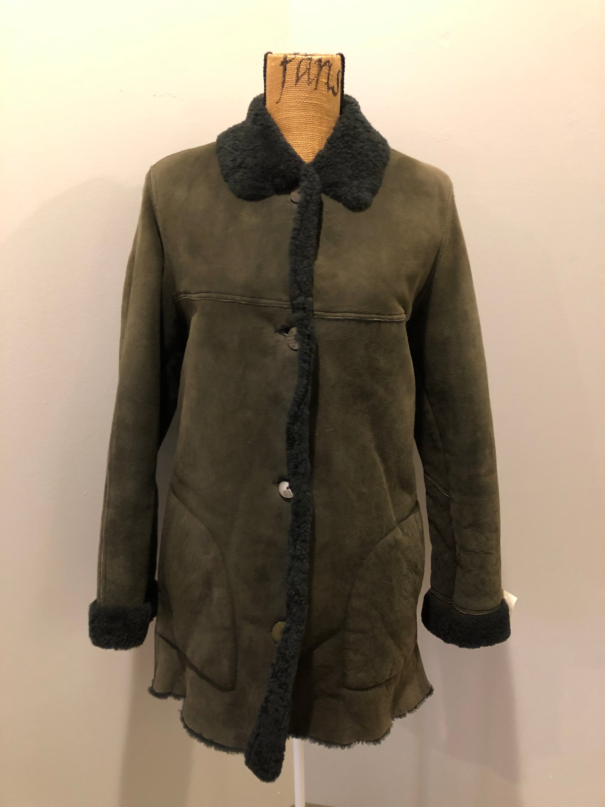 Hilary Radley green shearling coat with button closures and patch pockets. Made in Canada.