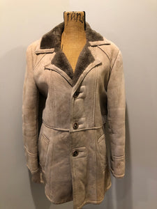 Kingspier Vintage - Leather Attic light brown suede coat with shearling lining, button closures and vertical pockets. Made in Canada. Size 38.