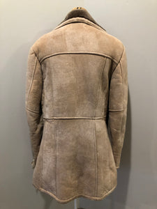 Kingspier Vintage - Leather Attic light brown suede coat with shearling lining, button closures and vertical pockets. Made in Canada. Size 38.