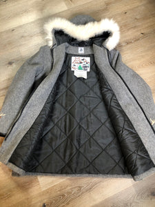 Kingspier Vintage - James Bay pure virgin wool northern parka in grey. This parka features a hood with white fur trim, zipper closure, quilted lining, knit inside hidden cuffs, patch pockets, felt deer appliqués on the front and on the sleeves. Made in Canada.
