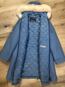 Kingspier Vintage - Northern Sun pure virgin wool northern parka in light blue. This parka features a hood with white fur trim, zipper closure, quilted lining, slash pockets, hidden inside knit cuffs, embroidered polar bear design on the front and back. Made in Canada.