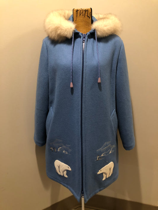 Kingspier Vintage - Northern Sun pure virgin wool northern parka in light blue. This parka features a hood with white fur trim, zipper closure, quilted lining, slash pockets, hidden inside knit cuffs, embroidered polar bear design on the front and back. Made in Canada.