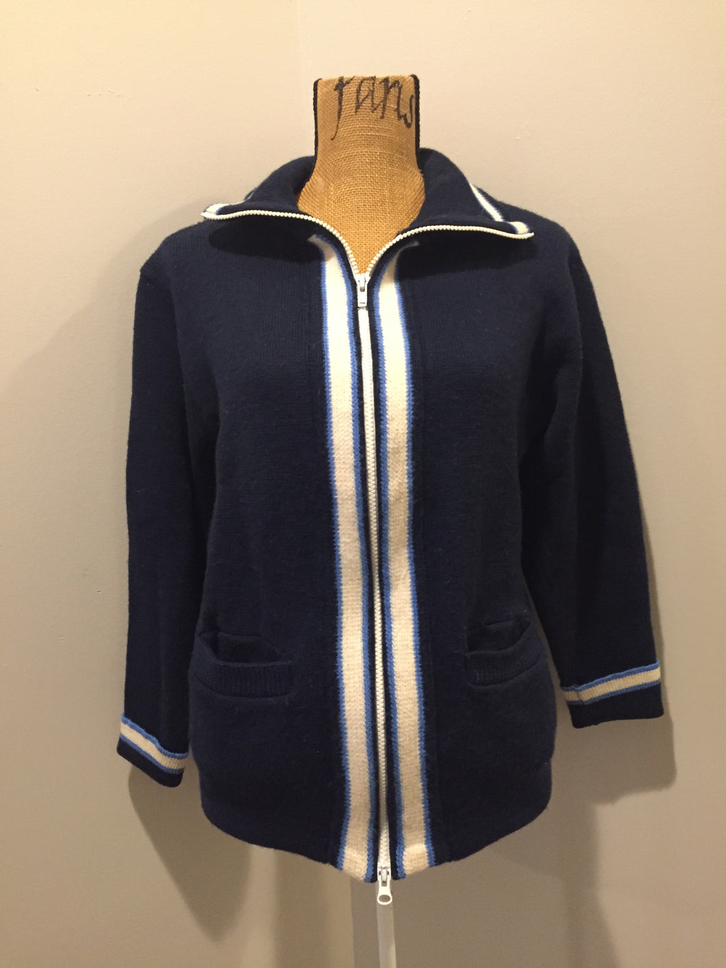 Kingspier Vintage - Vintage wool zip up cardigan in blue with white stripe trim, zipper closure and pockets. Made in Alberta. Size large.