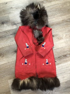 Kingspier Vintage - Children’s red northern parka featuring a hood, fur trim and pom poms, zipper closure, wool lining, patch pockets, embroidered winter scenes along the front. Made in Canada.