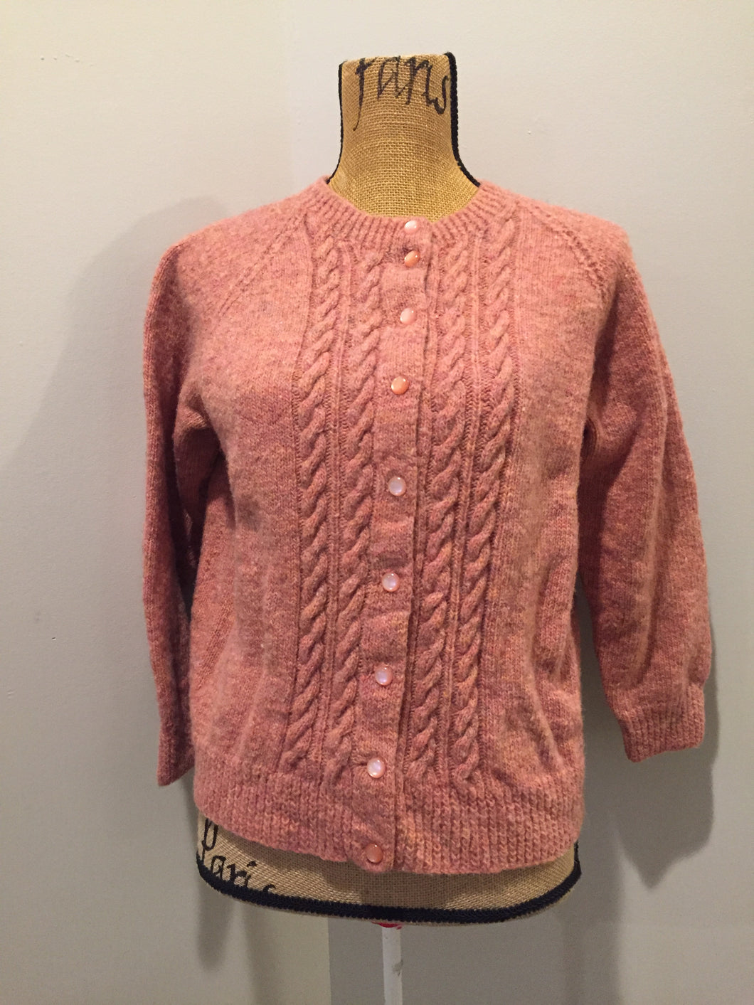 Kingspier Vintage - Hand Knit 100% wool cardigan in pink with cable knit stitch panel running down the center front. Size XS/S.