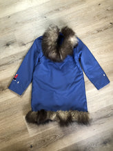 Load image into Gallery viewer, Kingspier Vintage - Children’s blue northern parka featuring a hood, fur trim and pom poms, zipper closure, wool lining, patch pockets, embroidered winter scenes along the front. Made in Canada. 
