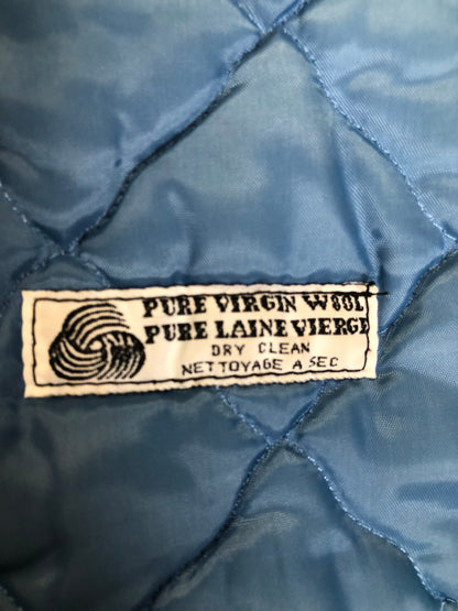 Kingspier Vintage - Northern Sun light blue pure virgin wool northern parka featuring a hood with white fur trim, zipper closure, quilted lining, slash pockets, hidden knit cuffs and arctic life design felt appliqué on the front and back. Made in Canada.