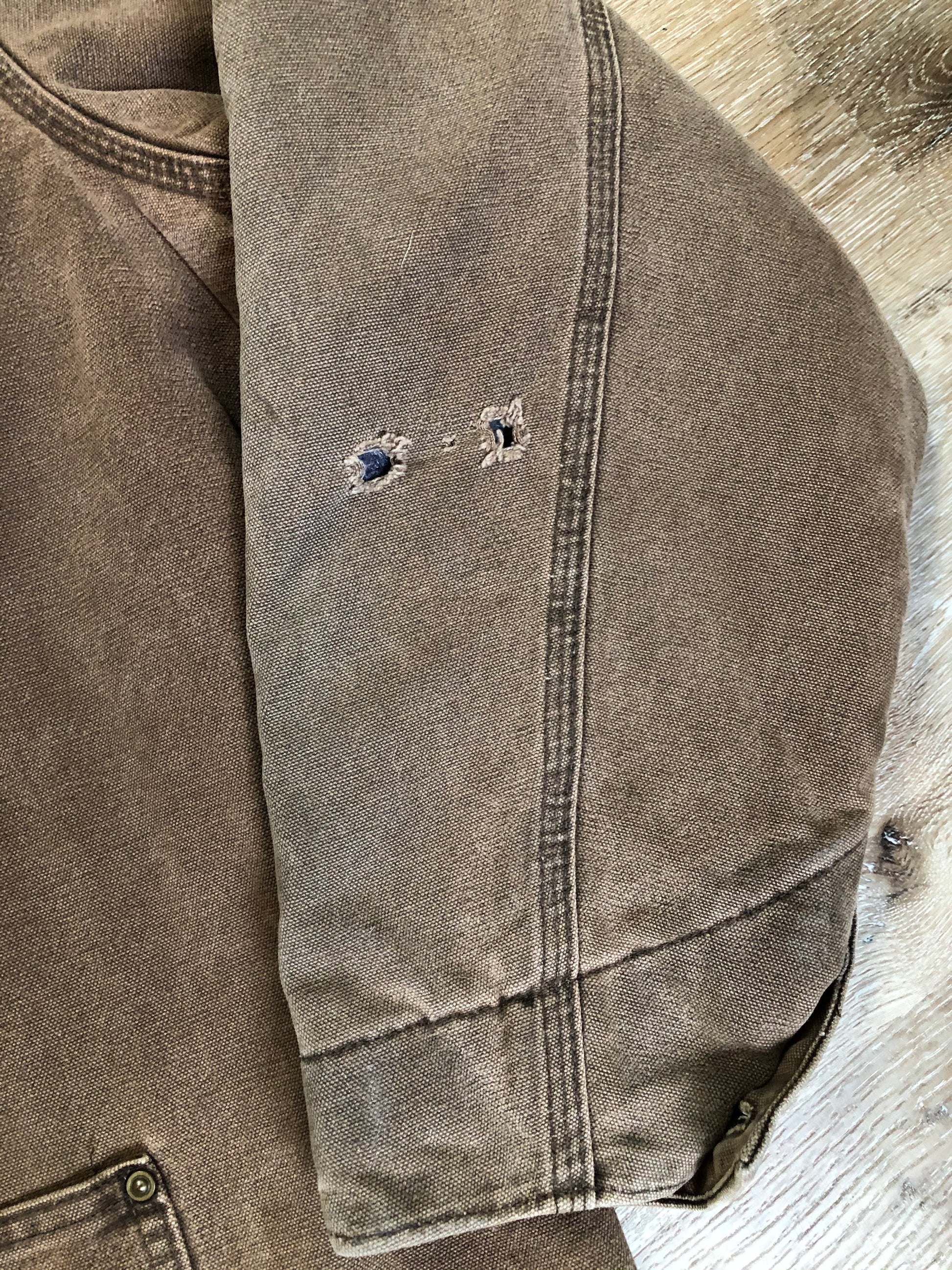 Kingspier Vintage - Carhartt brown chore jacket with brown corduroy collar, button closures, four patch pockets and a felted wool inside lining. Size XL