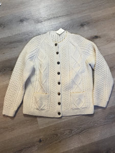 Kingspier Vintage - Vintage hand knit honeycomb and diamond stitch cardigan in white with crew neck, button closures and patch pockets. Size medium.