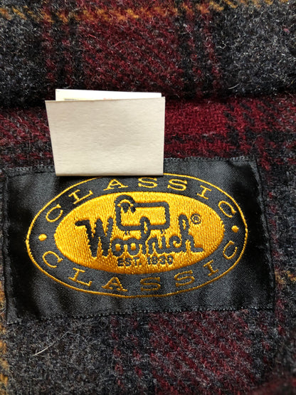 Kingspier Vintage - Woolrich red and grey plaid wool lumberjack shirt with button closures and one patch pocket on the chest.