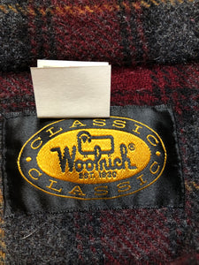 Kingspier Vintage - Woolrich red and grey plaid wool lumberjack shirt with button closures and one patch pocket on the chest.