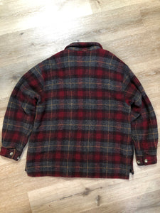 Kingspier Vintage - Woolrich red and grey plaid wool lumberjack shirt with button closures and one patch pocket on the chest.