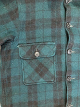 Load image into Gallery viewer, Kingspier Vintage - Woolrich dark green plaid wool lumberjack shirt with button closures and two flap pockets on the chest.
