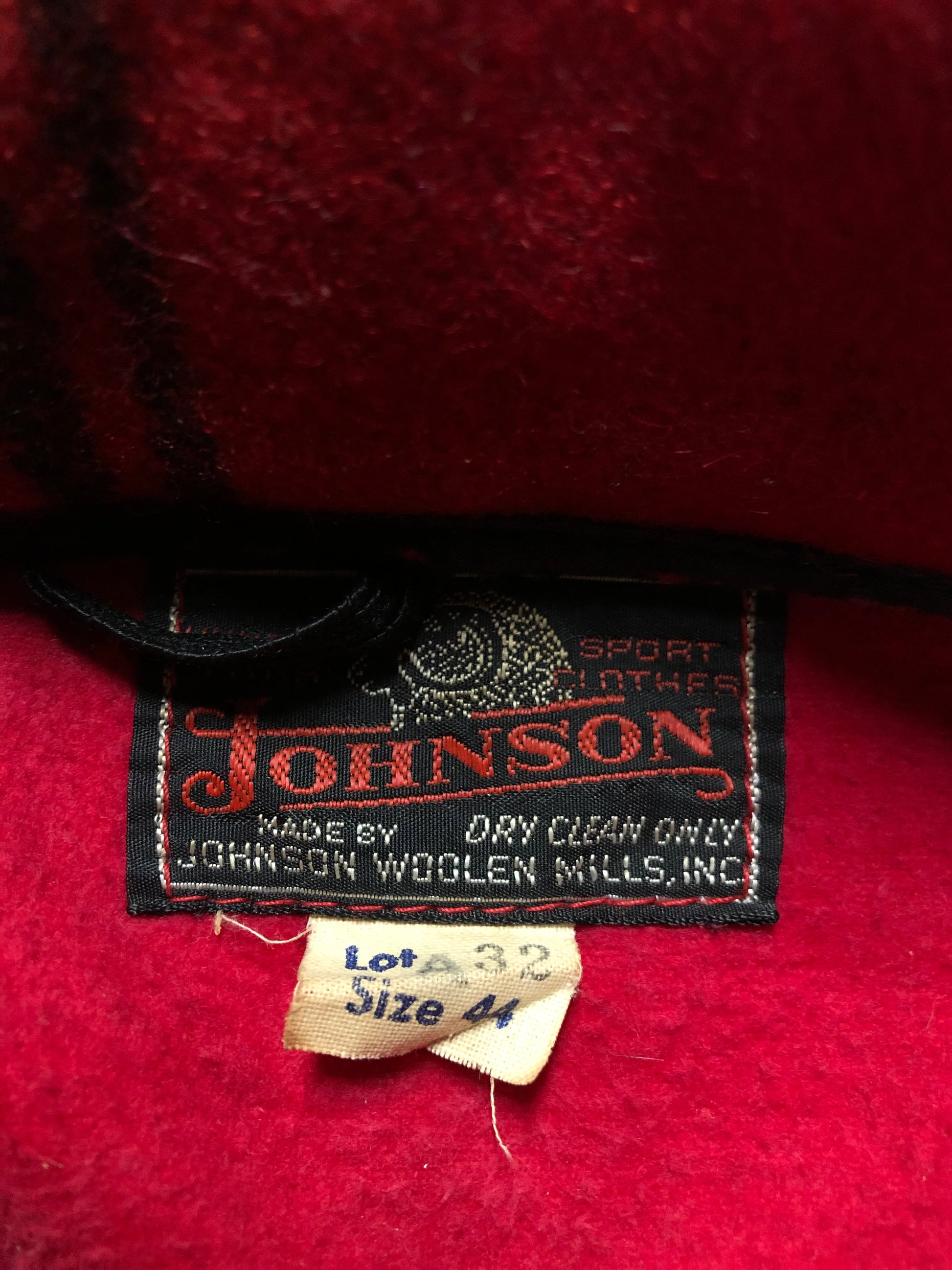 Kingspier Vintage - Johnson Woolen Mills red plaid wool hunting jacket with button closures, inside knit cuffs to keep cold air out, four flap pockets, two hand warming pockets, two side zip pockets and one inside pocket.