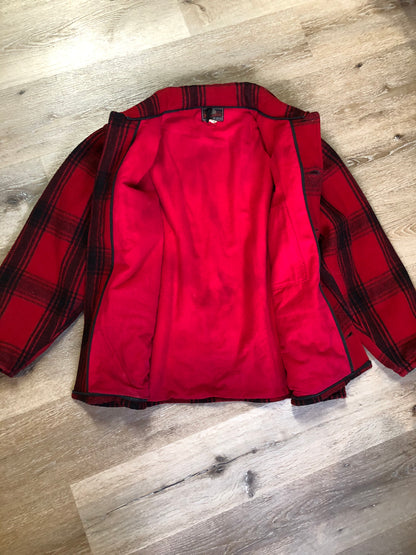 Kingspier Vintage - Johnson Woolen Mills red plaid wool hunting jacket with button closures, inside knit cuffs to keep cold air out, four flap pockets, two hand warming pockets, two side zip pockets and one inside pocket.