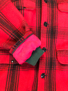 Kingspier Vintage - Johnson Woolen Mills red plaid wool hunting jacket with button closures, inside knit cuffs to keep cold air out, four flap pockets, two hand warming pockets, two side zip pockets and one inside pocket.