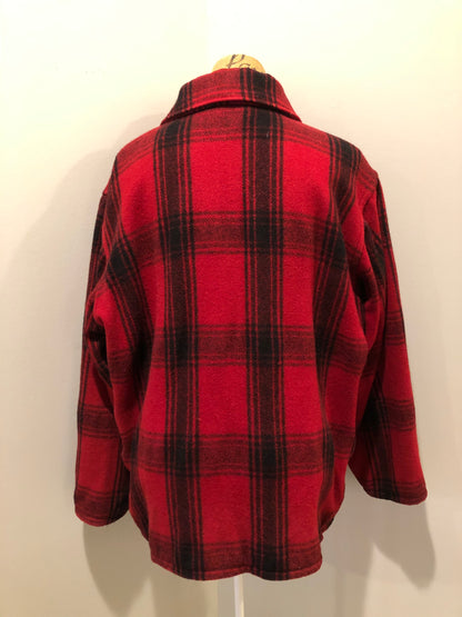 Kingspier Vintage - Johnson Woolen Mills red plaid wool hunting jacket with button closures, inside knit cuffs to keep cold air out, four flap pockets, two hand warming pockets, two side zip pockets and one inside pocket.