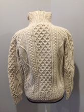Load image into Gallery viewer, Kingspier Vintage - Fisherman’s style honeycomb, diamond and braided knit wool cardigan in cream with button closures and patch pockets. Size small (womens).
