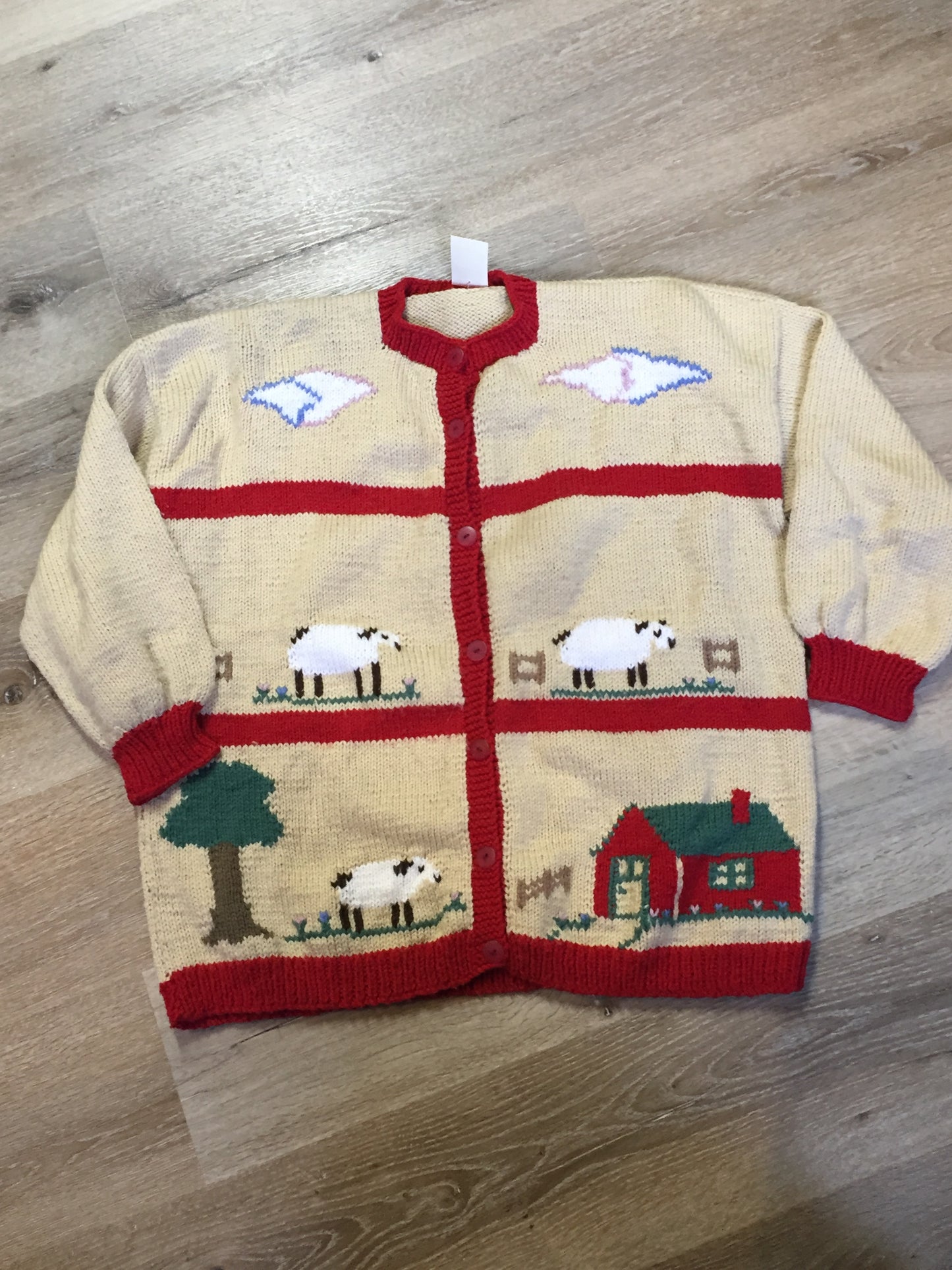 Kingspier Vintage - Hand knit cardigan in beige and red with sheep motif and buttons. Made with synthetic fibers.