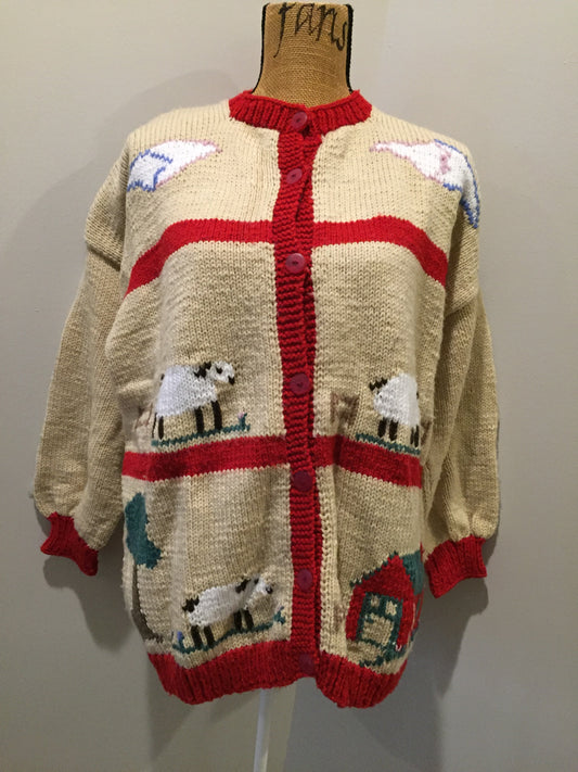 Kingspier Vintage - Hand knit cardigan in beige and red with sheep motif and buttons. Made with synthetic fibers.