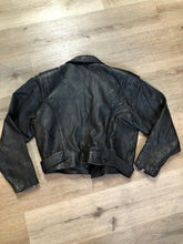 Load image into Gallery viewer, Kingspier Vintage - Cosa Nova black leather motorcycle jacket with two slash pockets, one flap pocket and a belt at the waist. Made in Canada. Size large.
