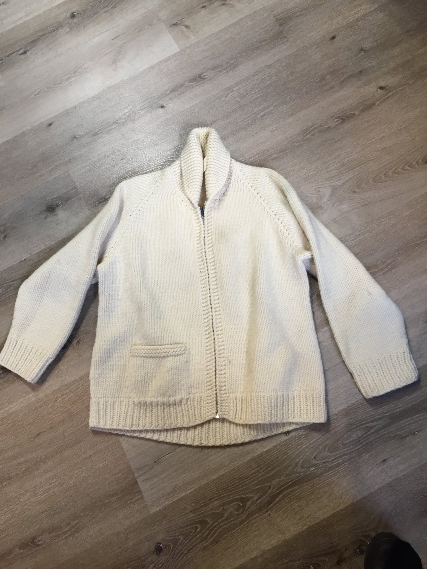 Kingspier Vintage - Mary Maxim wool cardigan in cream with ram design on the back, zipper closure and one pocket in the front. Made in Nova Scotia, Canada. Size large.