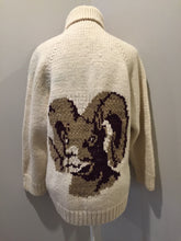 Load image into Gallery viewer, Kingspier Vintage - Mary Maxim wool cardigan in cream with ram design on the back, zipper closure and one pocket in the front. Made in Nova Scotia, Canada. Size large.
