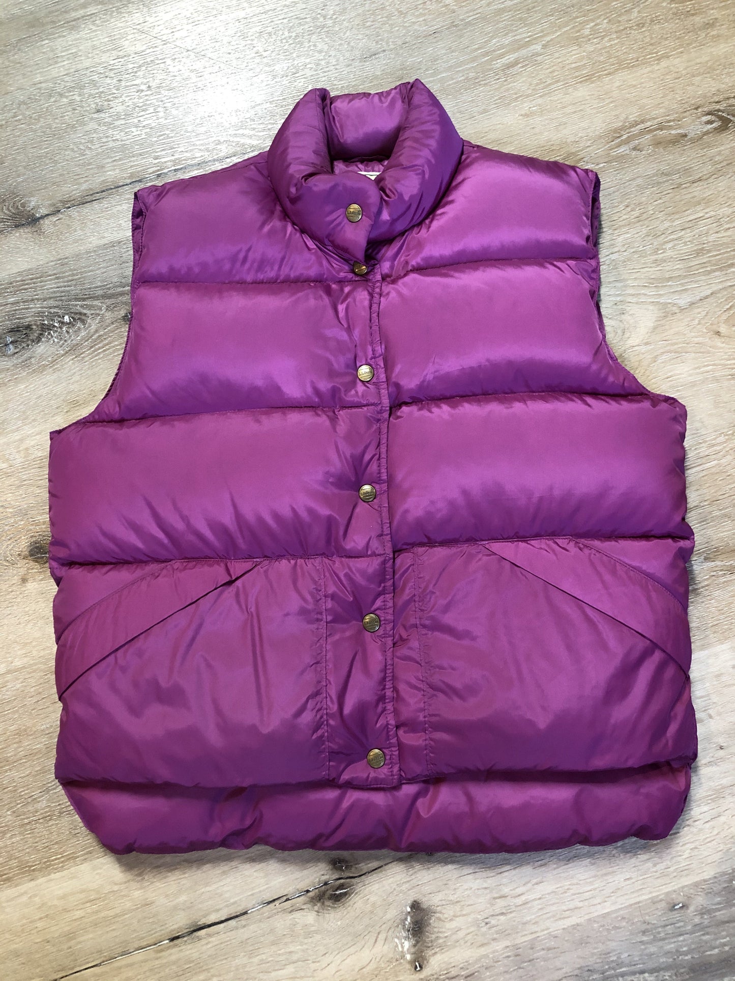 Kingspier Vintage - L.L.Bean dark pink down filled puffer vest with snap closures, slash pockets and is longer in the back. Size medium.