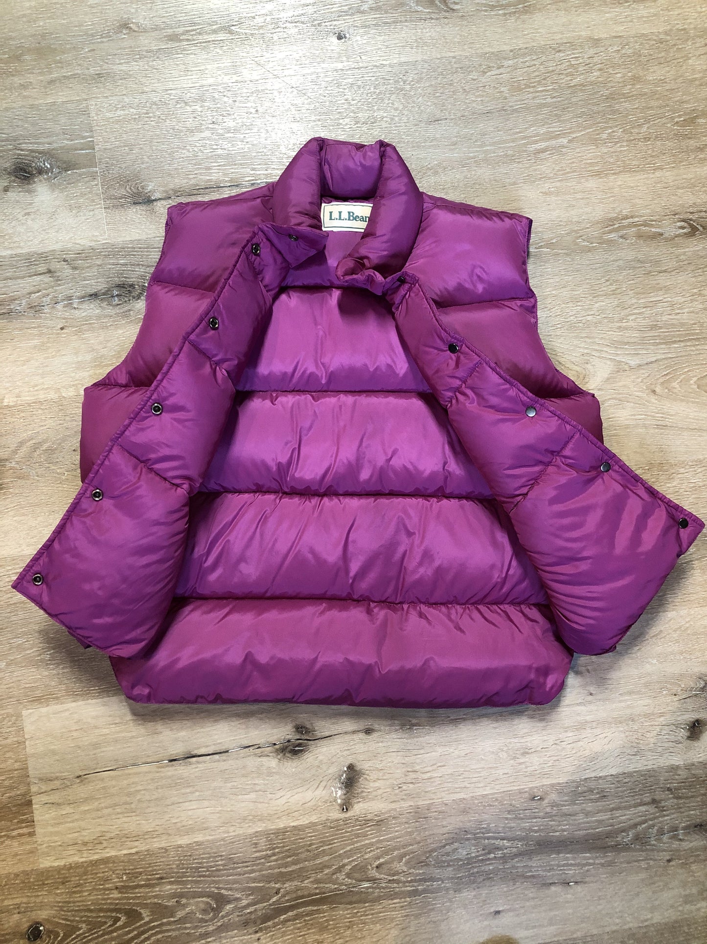 Kingspier Vintage - L.L.Bean dark pink down filled puffer vest with snap closures, slash pockets and is longer in the back. Size medium.