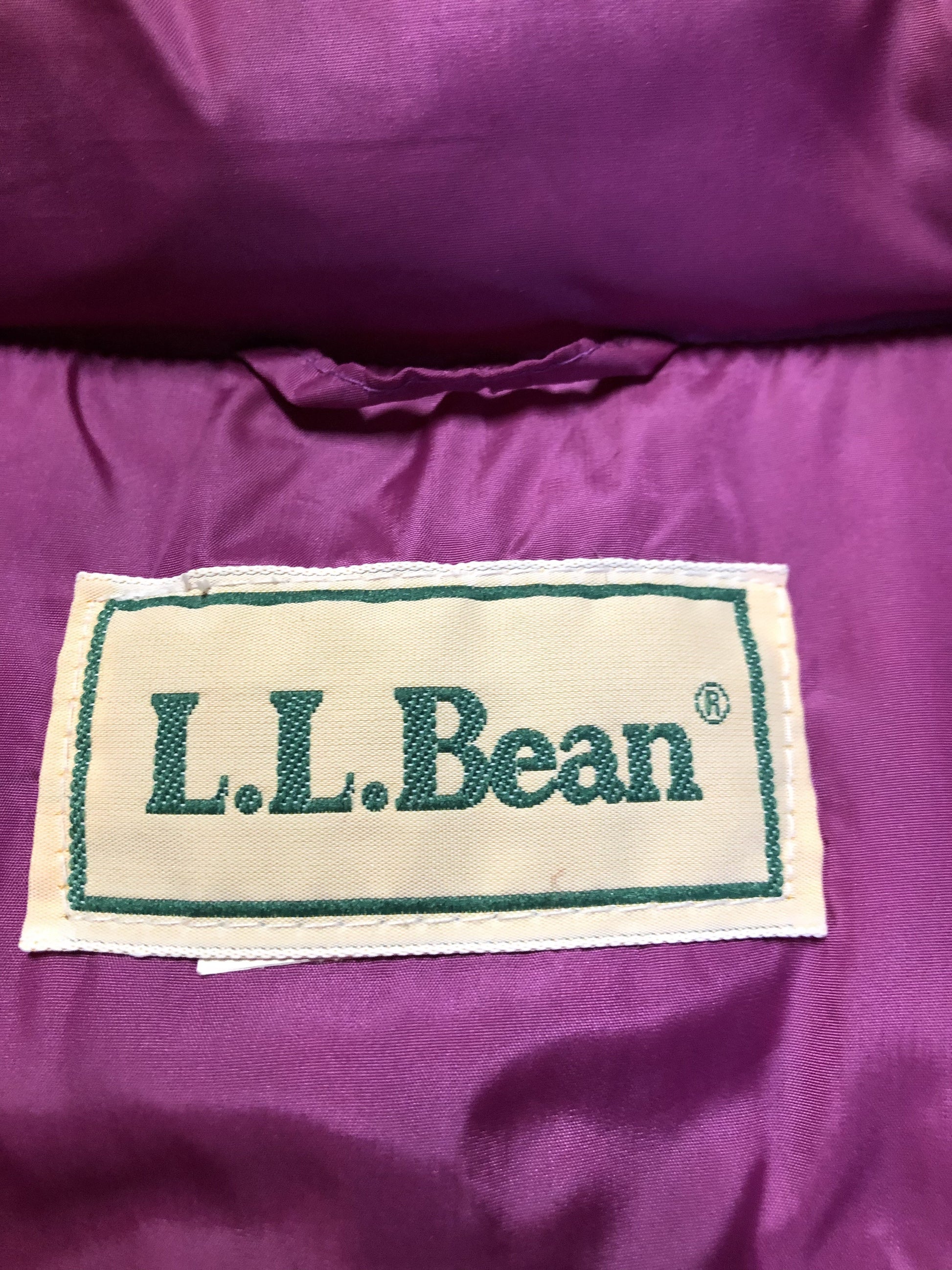 Kingspier Vintage - L.L.Bean dark pink down filled puffer vest with snap closures, slash pockets and is longer in the back. Size medium.