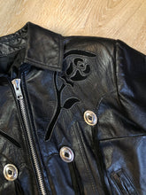 Load image into Gallery viewer, Kingspier Vintage - Vintage 1980’s Bristol “Golden Crown” black leather motorcycle jacket with leather fringe, suede rose applique in the front and back, silver hardware, lace up sides zipper closure, zip pockets and a quilted lining. Made in Canada. Women’s size small.
