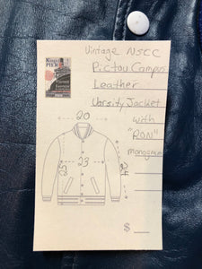 Kingspier Vintage - Vintage NSCC Pictou Campus leather varsity jacket in blue and white with snap closures, slash pockets, “Pictou Campus” embroidered on the chest, “NSCC” Embroidered on the back and “Ron” monogram embroidered on the sleeve,