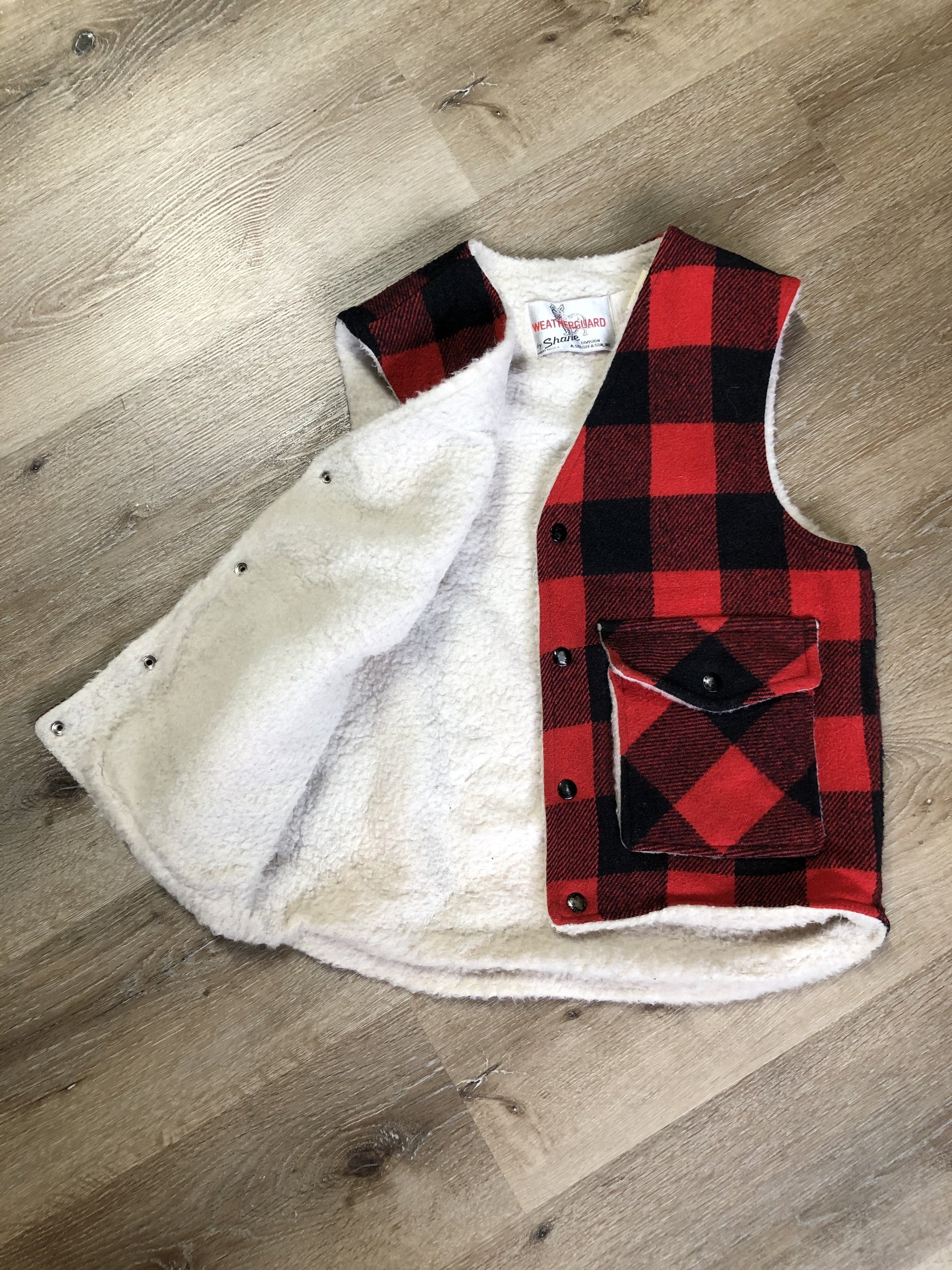 Kingspier Vintage - Shane “Weatherguard” red and black plaid wool vest with snap closures and flap pockets. Made in the USA.