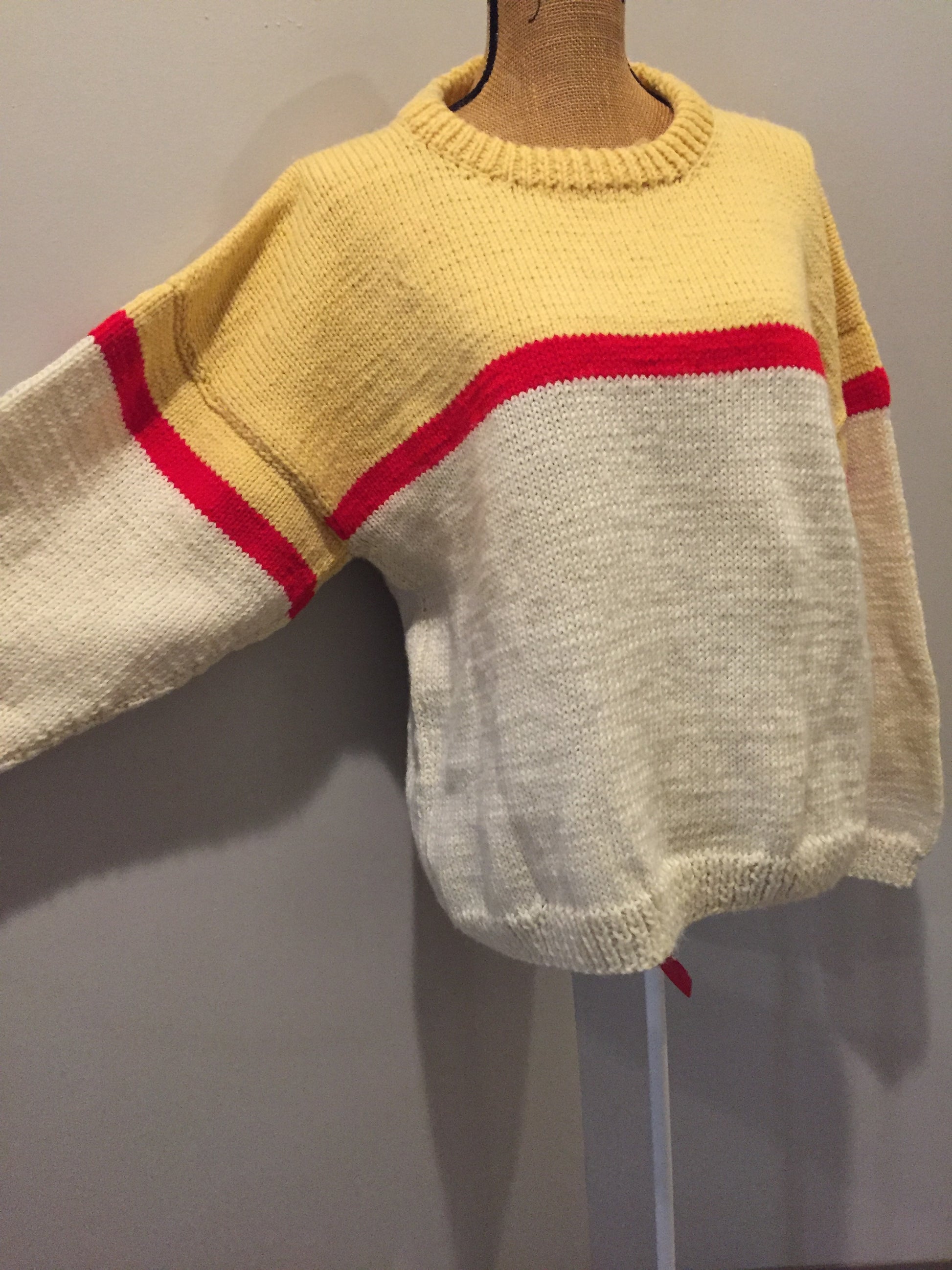 Kingspier Vintage - Hand knit cream, yellow and red sweater. Fibres unknown. Size medium. 