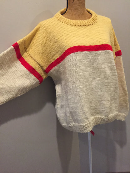 Kingspier Vintage - Hand knit cream, yellow and red sweater. Fibres unknown. Size medium. 