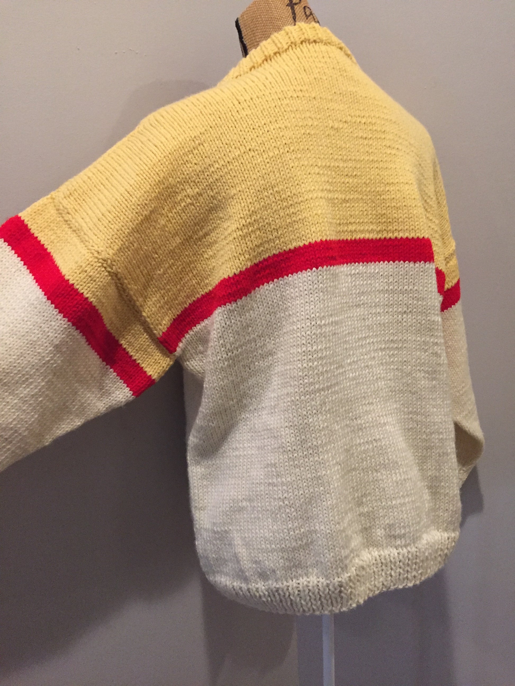 Kingspier Vintage - Hand knit cream, yellow and red sweater. Fibres unknown. Size medium. 