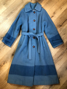 Kingspier Vintage - Hudson’s Bay Company blue and black stripe 100% virgin wool point blanket coat in a swing coat style with belt, buckle detail at the collar, button closures, slash pockets and blue satin lining. Made in England. Size large.