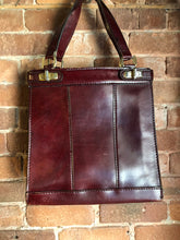 Load image into Gallery viewer, Kingspier Vintage - Caggiano deep red calfskin leather purse with brass hardware, two buckles on each side to allow the top to open fully, inside dividers and pockets. Made in Italy.
