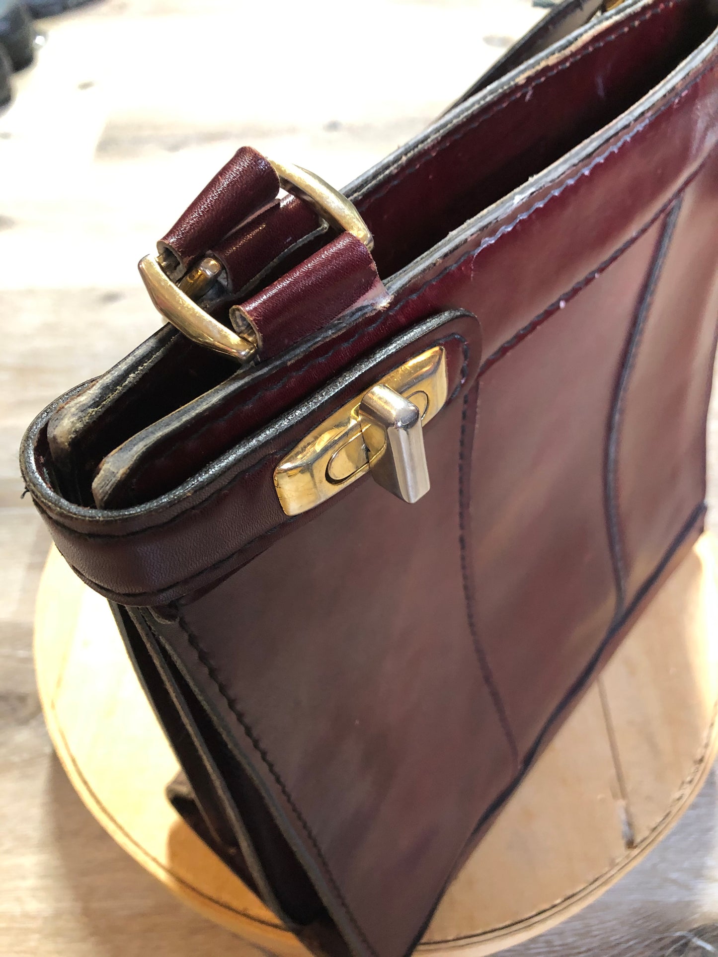 Kingspier Vintage - Caggiano deep red calfskin leather purse with brass hardware, two buckles on each side to allow the top to open fully, inside dividers and pockets. Made in Italy.