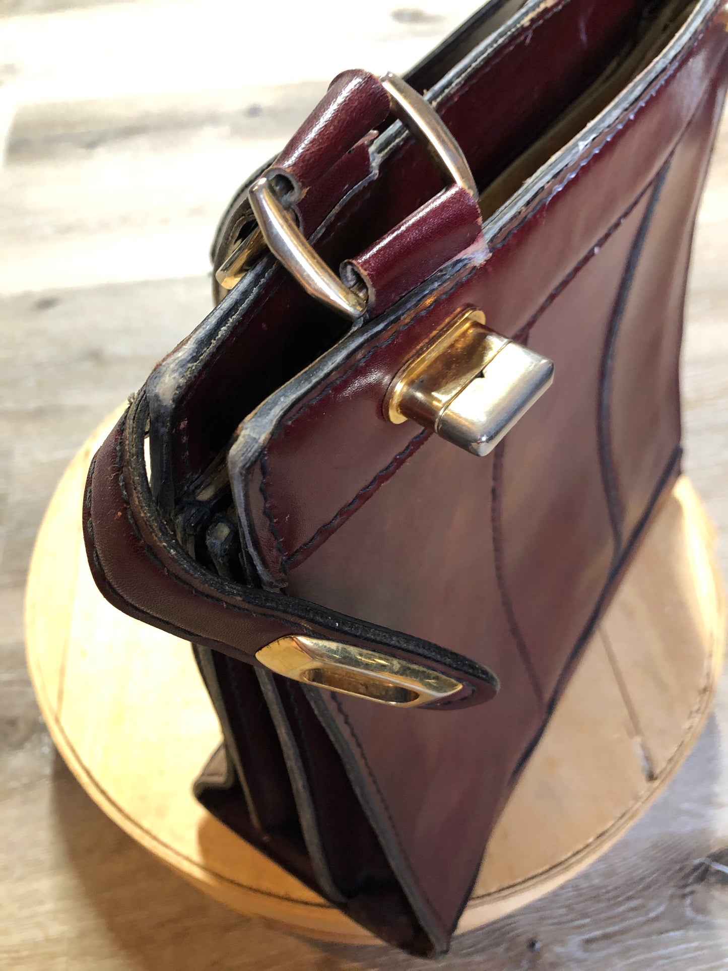 Kingspier Vintage - Caggiano deep red calfskin leather purse with brass hardware, two buckles on each side to allow the top to open fully, inside dividers and pockets. Made in Italy.