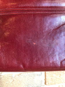 Kingspier Vintage - Deep red leather handbag circa 1950’s with brass metal details and clasp.