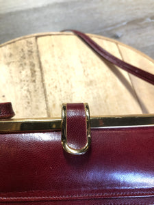 Kingspier Vintage - Deep red leather handbag circa 1950’s with brass metal details and clasp.