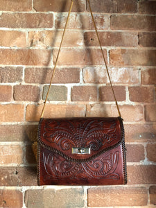 Kingspier Vintage - Hand tooled brown leather purse with leather stitching around the trim and a red leather flower motif lining.
