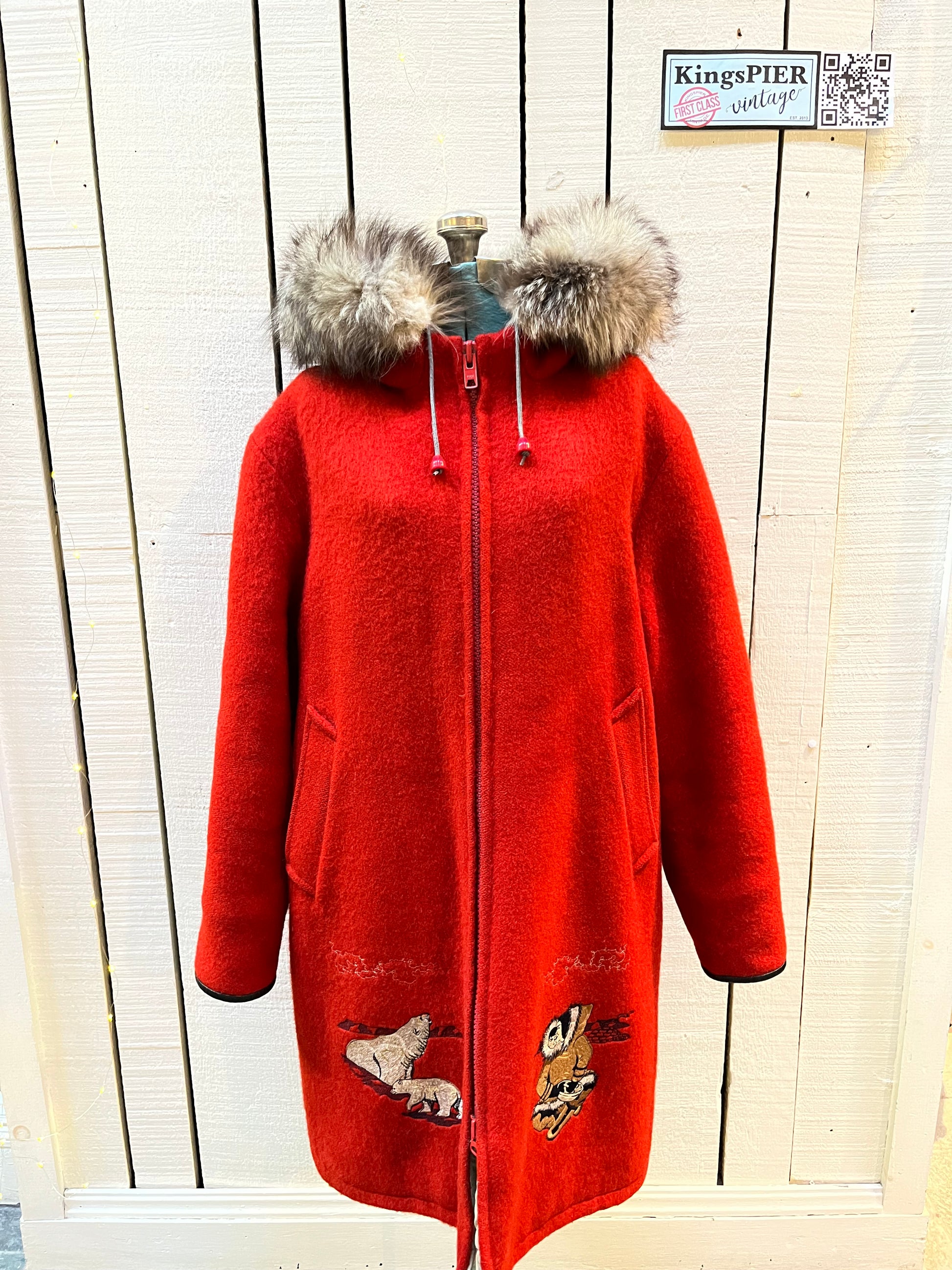 Vintage Central Sportswear Co. red 100% pure virgin wool northern parka with zipper closure, handwarmer pockets, quilted lining, fur trimmed hood and embroidered northern life motif.
 
Made in Canada
Size 12