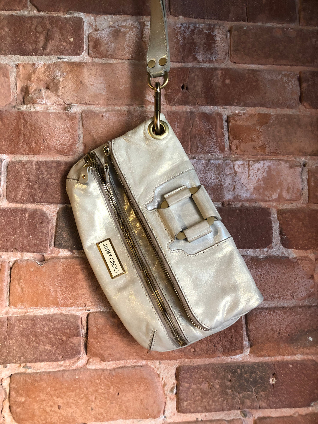 Kingspier Vintage - Authentic Jimmy Choo Mave foldover clutch in Iridescent white calfskin leather with gold hardware, suede lining, magnetic snap and zip closures.
