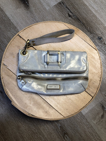 Kingspier Vintage - Authentic Jimmy Choo Mave foldover clutch in Iridescent white calfskin leather with gold hardware, suede lining, magnetic snap and zip closures.