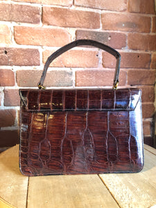 Kingspier Vintage - Bellestone red/brown lizard handbag, circa 1970’s with top handle, leather lining, brass hardware and clasp closure.